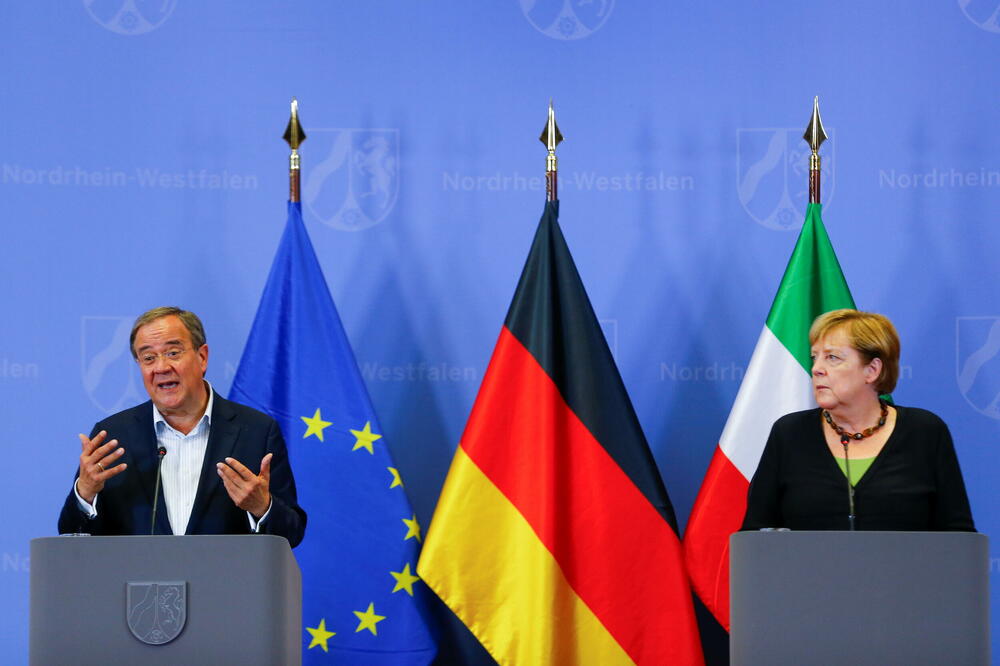 Lašet i Merkel, Foto: Reuters