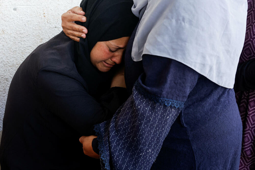 Reakcija žene pored tijela ubijenih Palestinaca, Foto: reuters