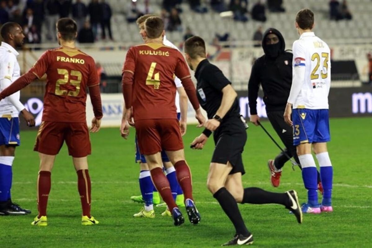 Hajduk Split captain confronts masked hooligan after he charges onto the  pitch and chases referee with iron bar - Mirror Online