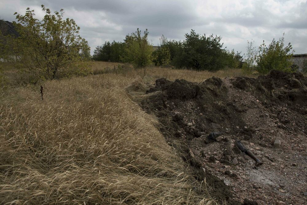 Masovna grobnica, Ukrajina, Foto: Reuters