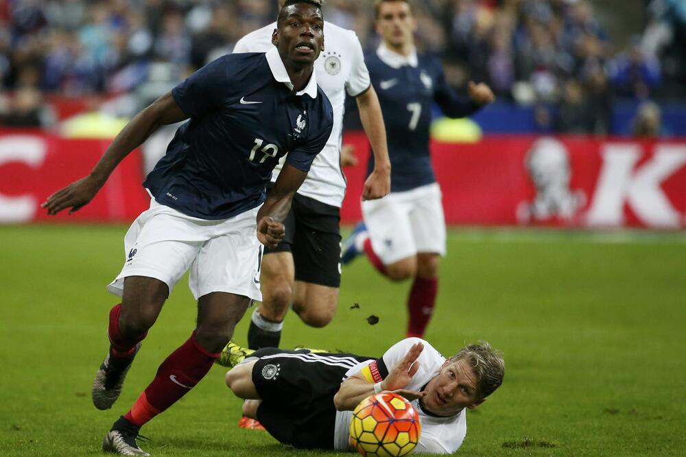 Bastijan Švajnštajger i Pol Pogba, Foto: Reuters