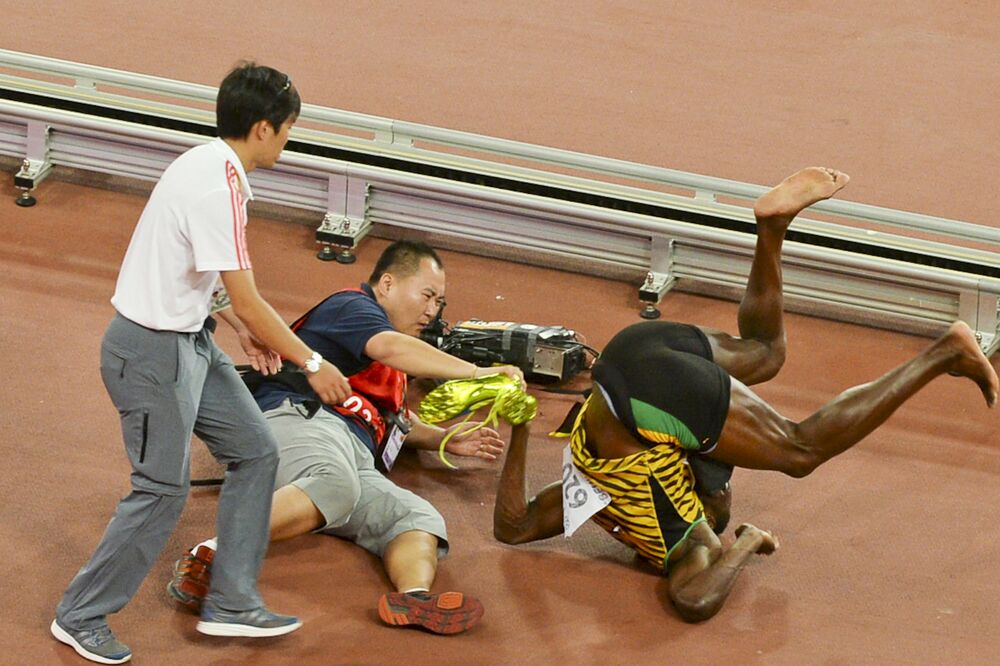 Usein Bolt i kamerman, Foto: Reuters