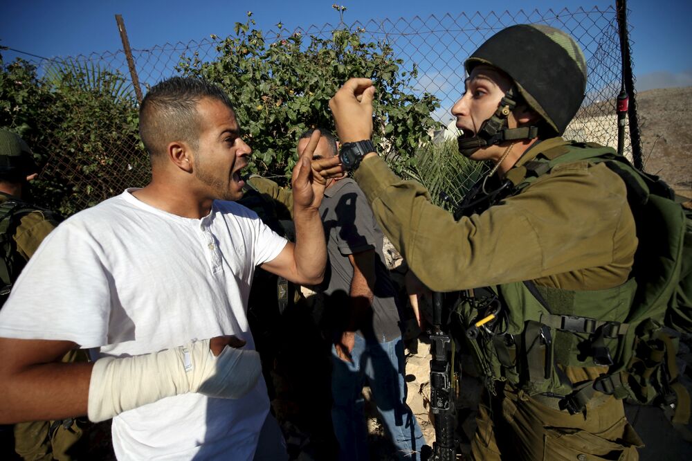 Palestinac, izraelski vojnik, Foto: Reuters