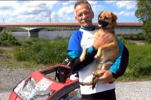 Poljak i njegov pas trče oko države za napuštene životinje