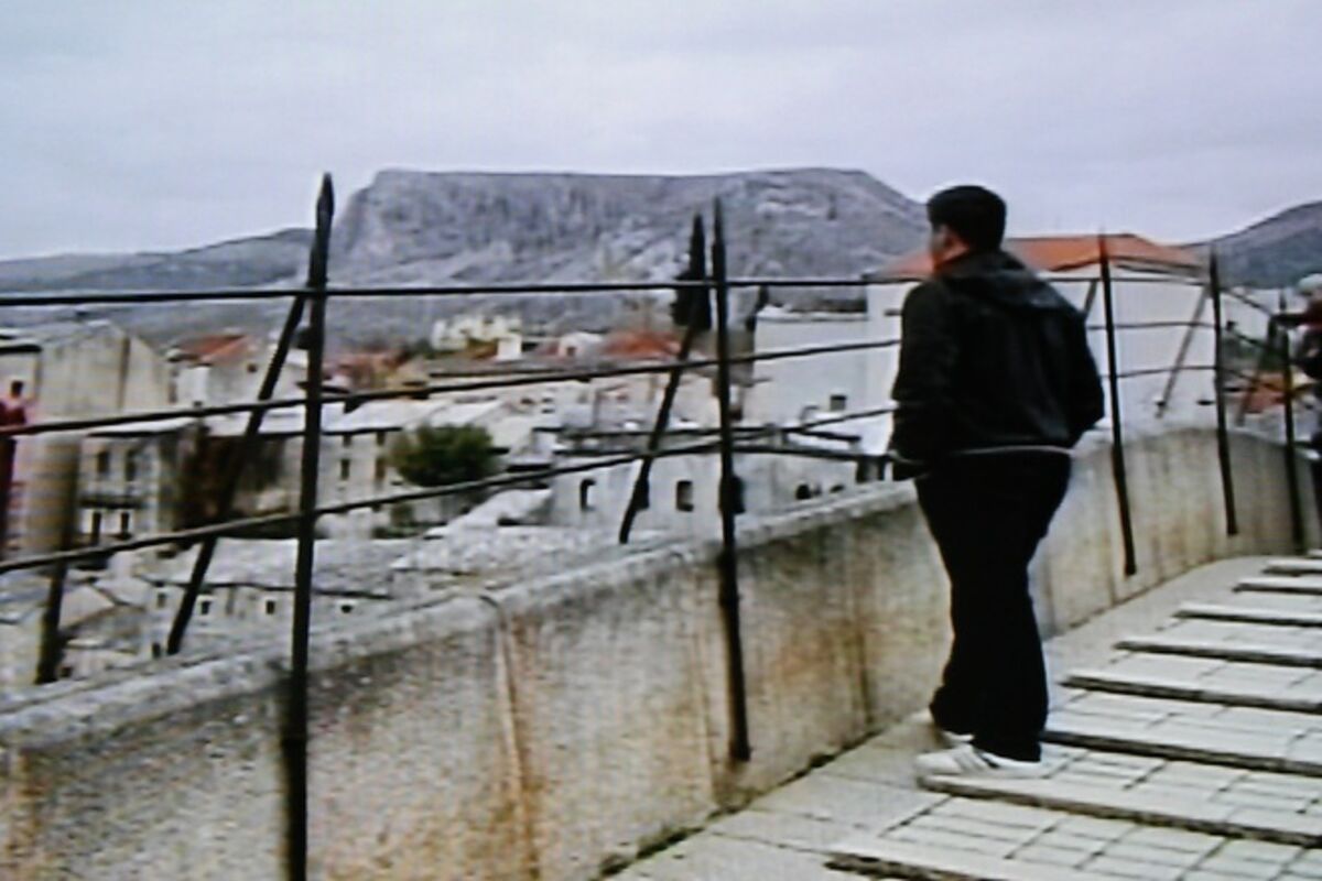 Ante grew up in Mostar, but now he is standing on the Old Bridge for