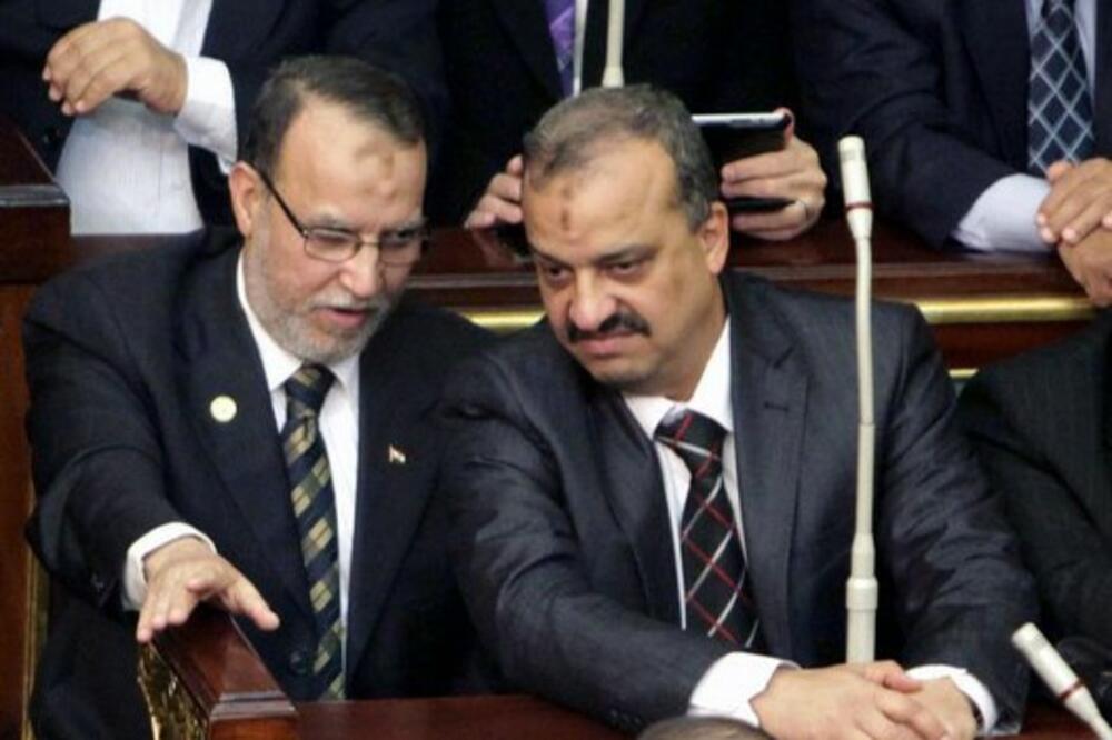 Funkcioner Partije za slobodu i pravdu i Muhamed el Beltagi, Foto: AP