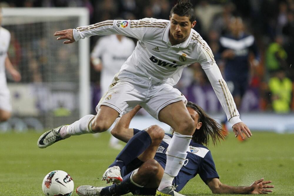 Kristijano Ronaldo i Martin Demikelis, Foto: Beta/AP