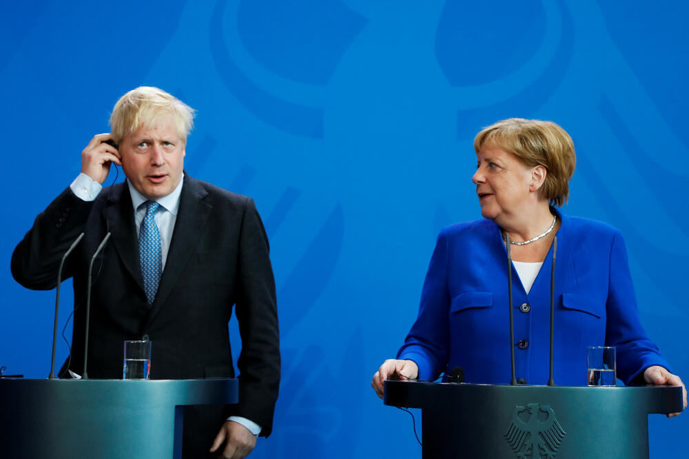 Džonson i Merkel pred novinarima, Foto: Reuters