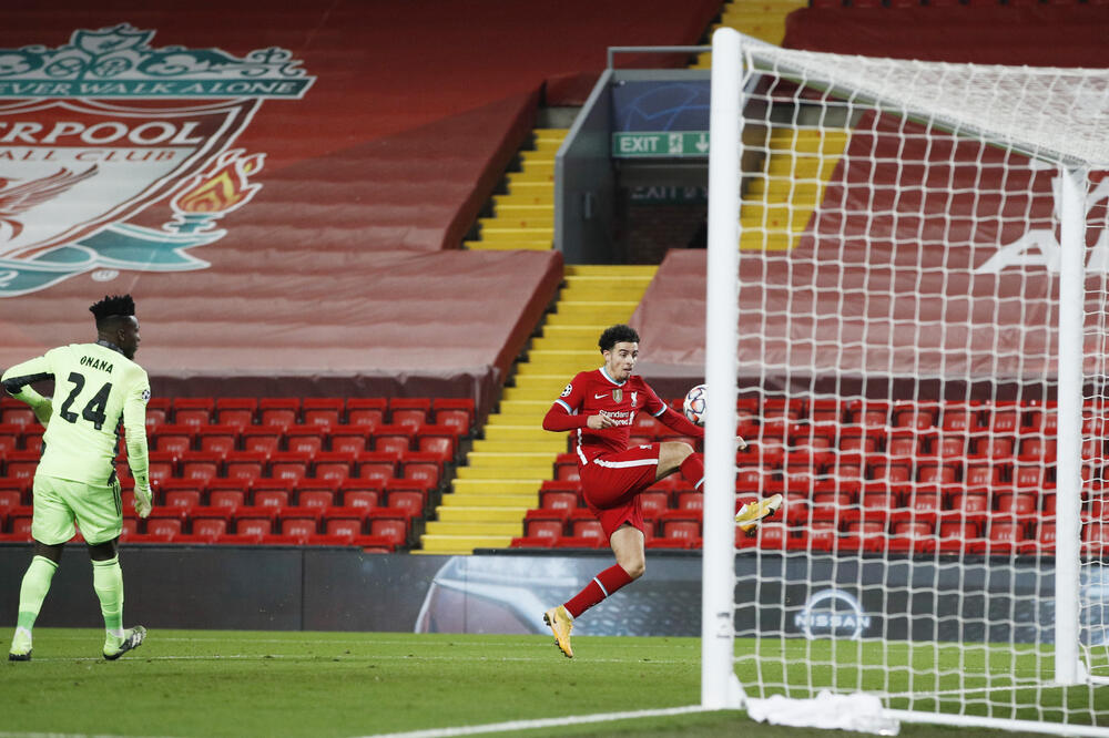 Džons postiže gol za Liverpul, Foto: Reuters