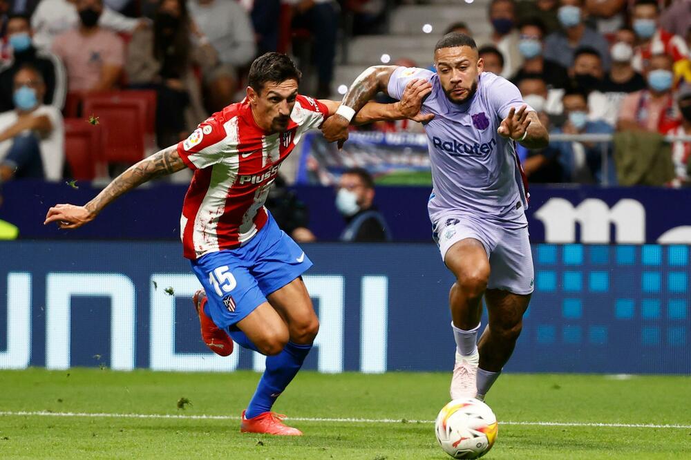 Savić u duelu sa Depajom sinoć u Madridu, Foto: Reuters