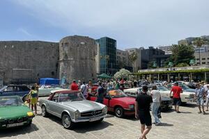 Oldtimers in front of the walls of Budva's Old Town
