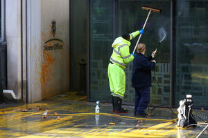 Environmental activists sprayed paint on a state building and one...