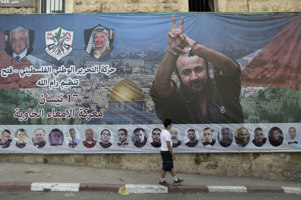 Grafit u Ramali palestinskog lidera Marvana Bargutija čije oslobađanje iz zatvora zahtijeva Hamas, Foto: Beta/AP