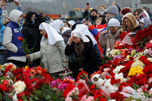 Day of Mourning in Russia: Citizens light candles and lay flowers in front of...