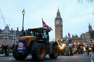 Farmers in protest driving tractors from the south of England to the building...