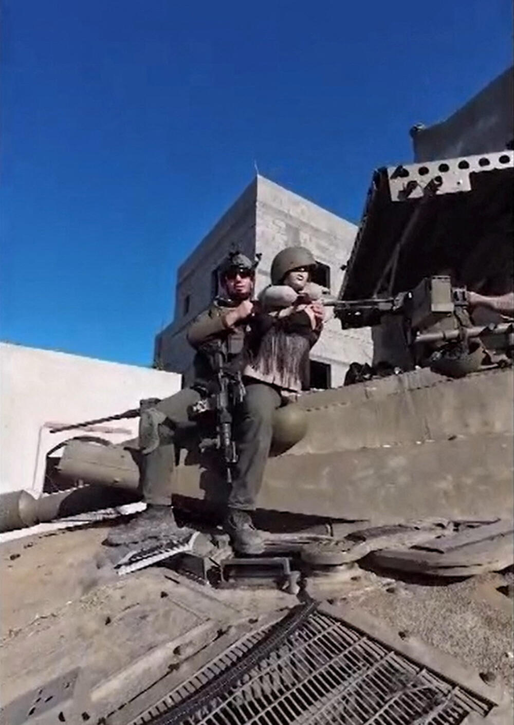An IDF man with a mannequin on a tank, allegedly in Khan Younis