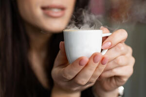 How does caffeine work and is it better to drink hot or cold coffee?