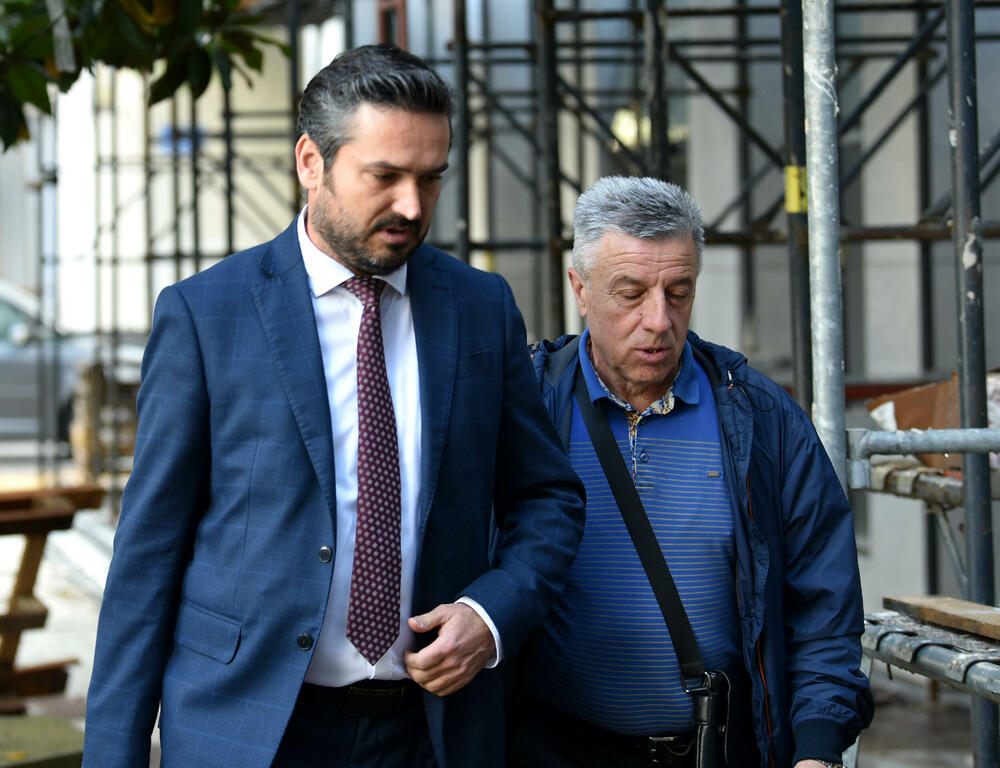 Maksić (right) with a lawyer