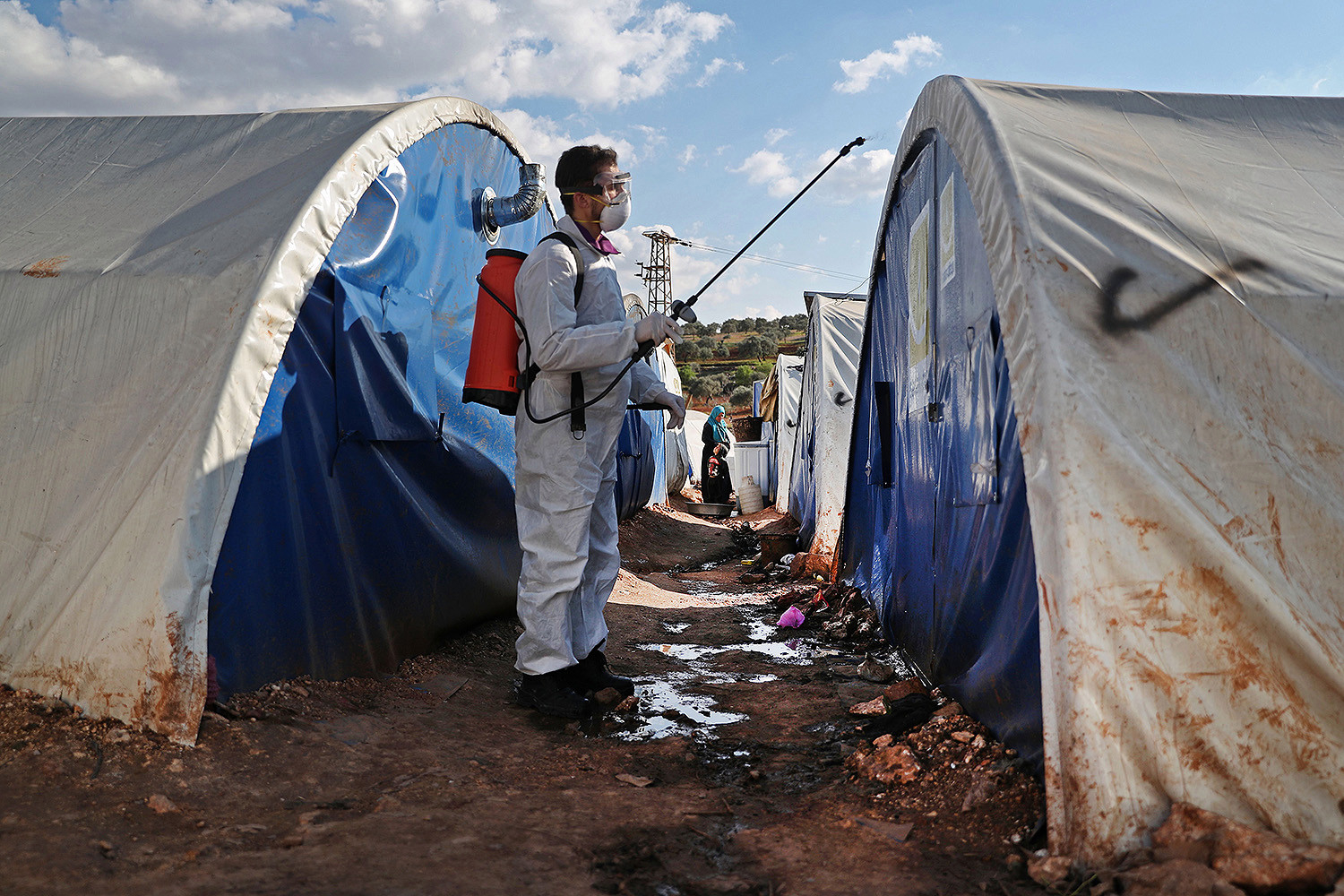 Disinfection of a camp for displaced persons in a Syrian village